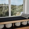 Bedroom with Cali Bamboo flooring, Andersen 100 series windows, custom window seat by Mike Gagne. Acer water tank. Oliver Yaphe pillows.